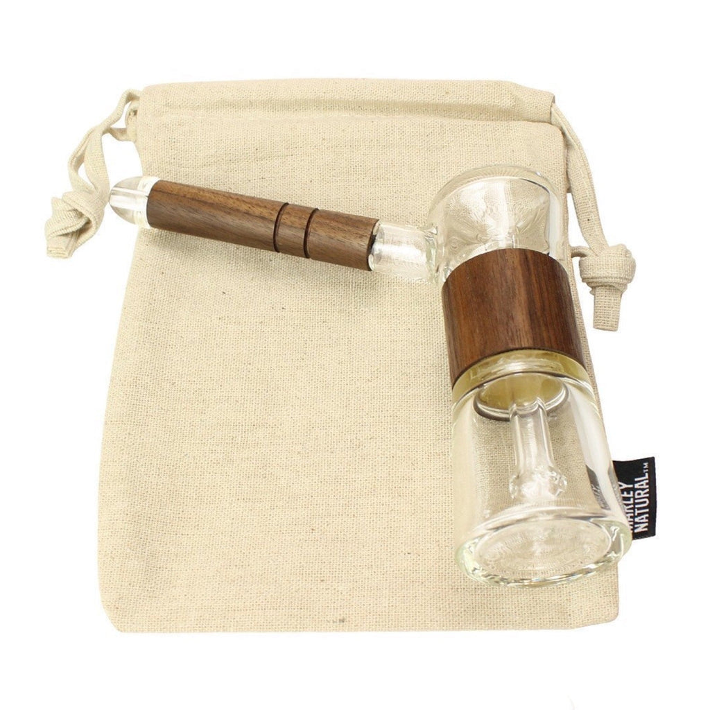 a small glass bottle with a wooden handle